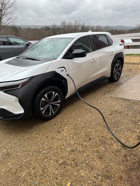 An electric vehicle charging at Dismas Family Farm